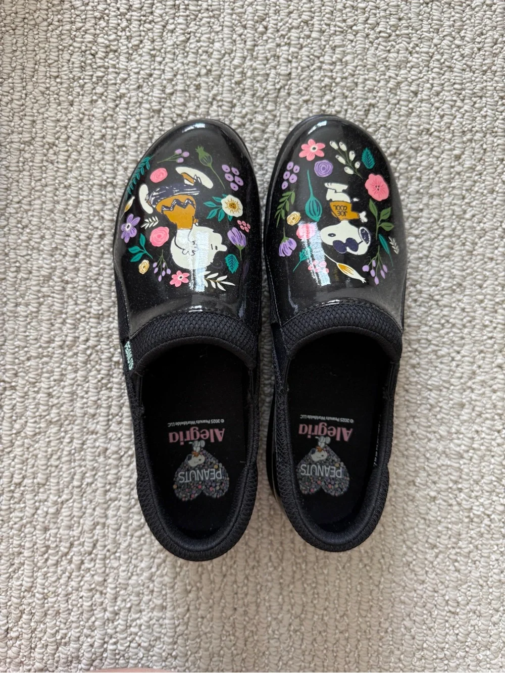 Alegria Kids Black Slip-On Sneakers with Colorful Peanuts Floral Art